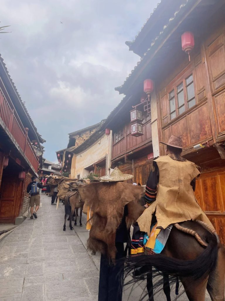 Tourist riding a horse along the ancient Tea Horse Road by Lashi Lake