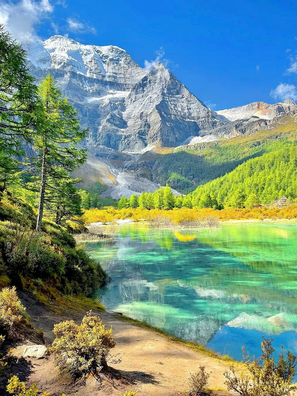 Five-Color Lake at Yading Nature Reserve in Sichuan — stunning alpine lake surrounded by sacred snow mountains — PandaPower Travel