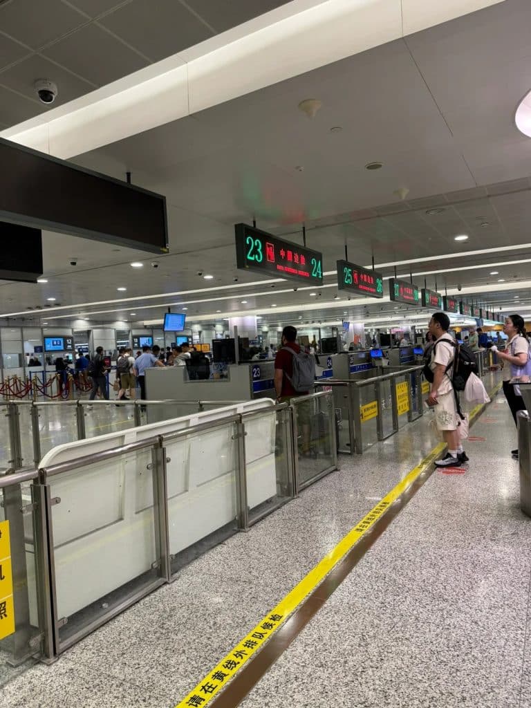 Foreign travelers entering China at airport immigration checkpoint