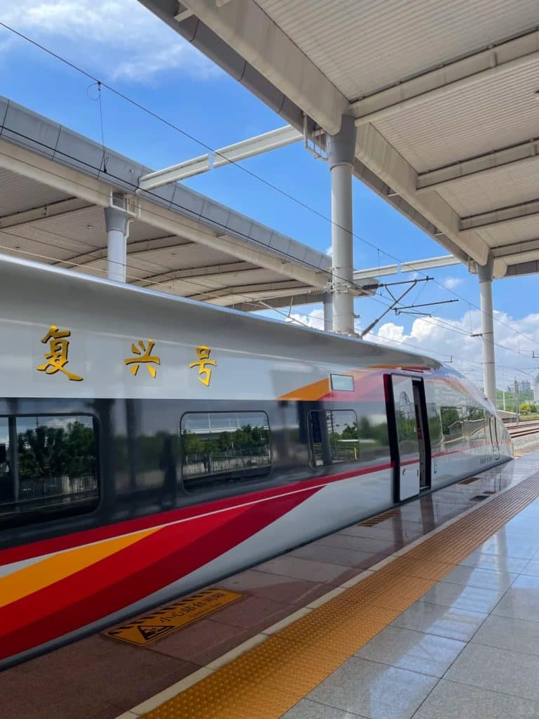 China high-speed train at railway station platform for foreign travelers guide