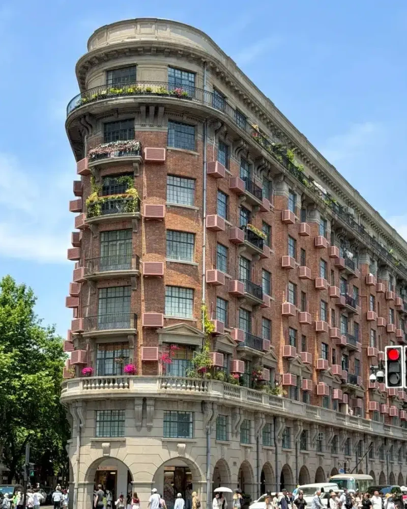 Wukang Mansion at a street junction in Shanghai