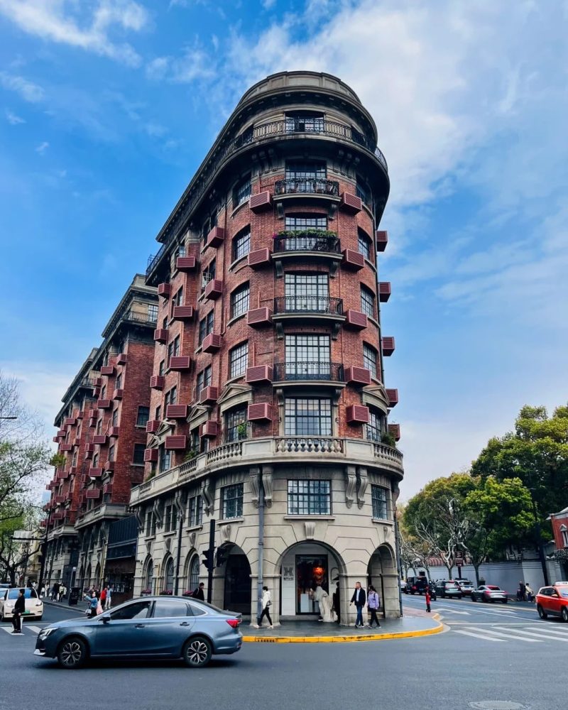 Wukang Mansion on a tree-lined street in Shanghai
