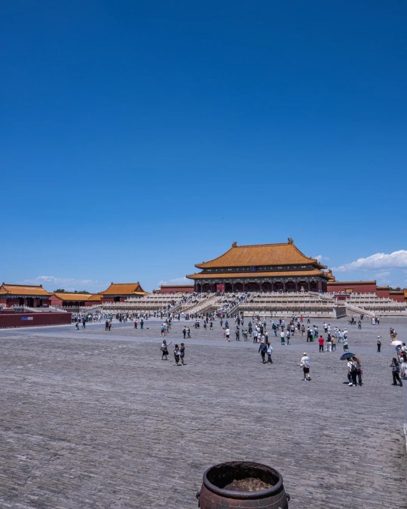 Forbidden City courtyard with palace halls under a blue sky in Beijing