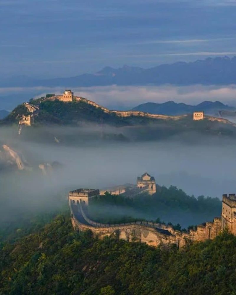 Great Wall of China rising through clouds on a 30-day private China grand tour from Beijing to the Silk Road and Shanghai