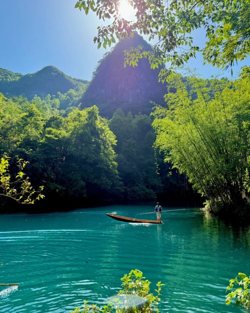 Turquoise river and forest scenery in Guizhou