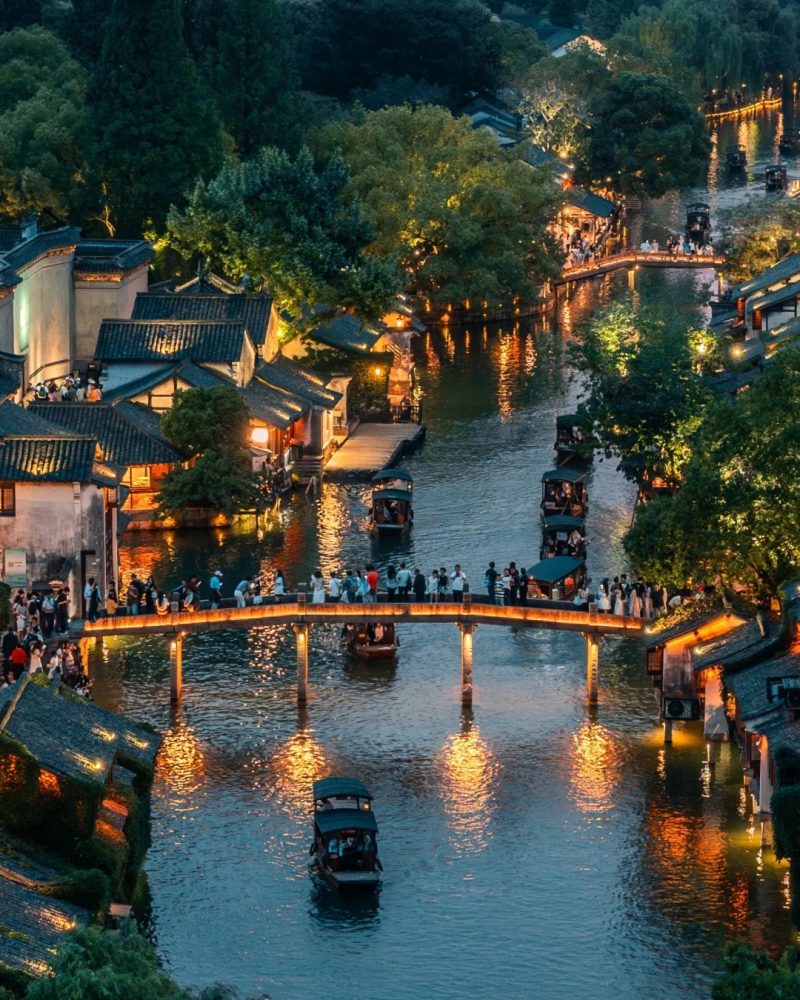 Wuzhen water town night view with canals and bridges in Hangzhou area during a private China tour