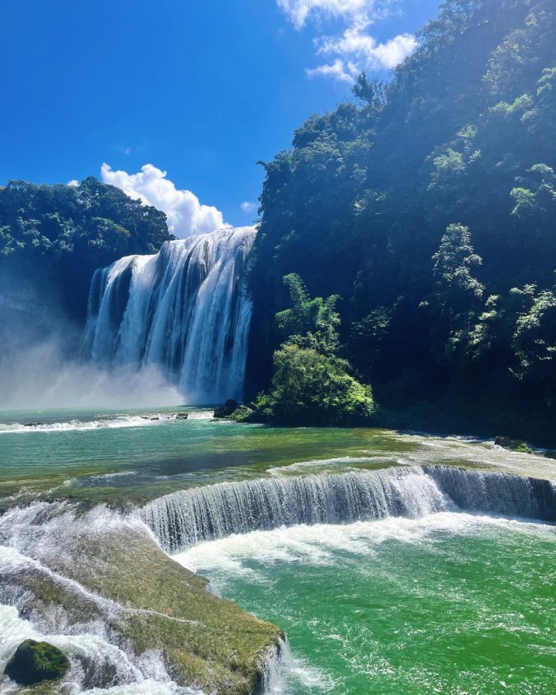 Huangguoshu Waterfall in Guizhou with mist and green cliffs