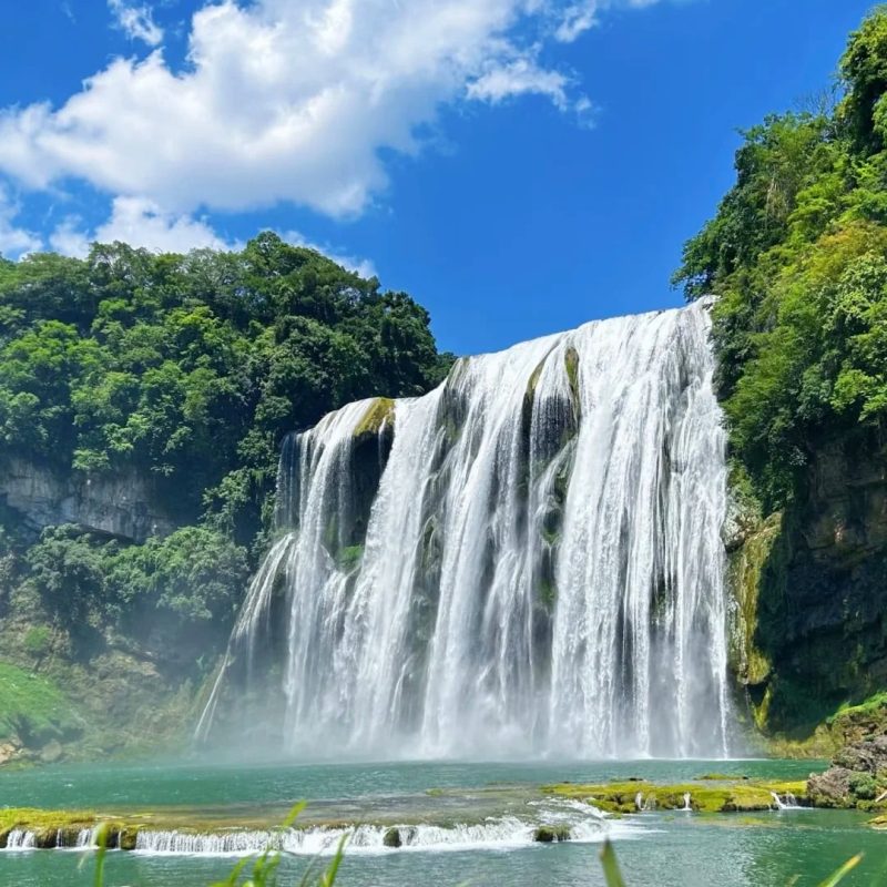 Huangguoshu Waterfall, Guizhou Huangguoshu Waterfall in Guizhou with wide cascading water and blue sky