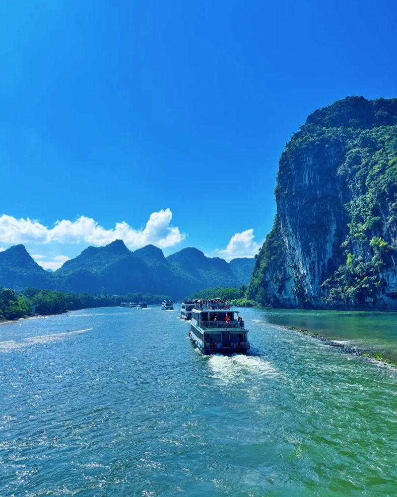 Li River cruise in Guilin, China, with limestone peaks and scenic river views