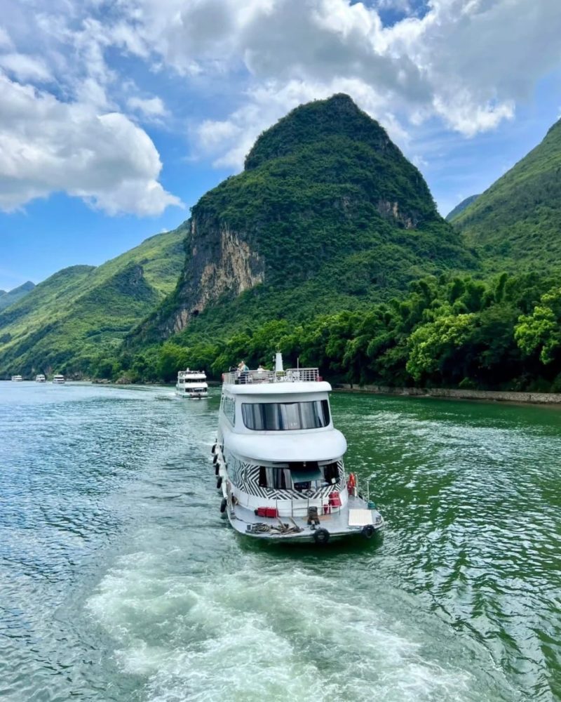 Li River cruise boat traveling from Guilin toward Yangshuo