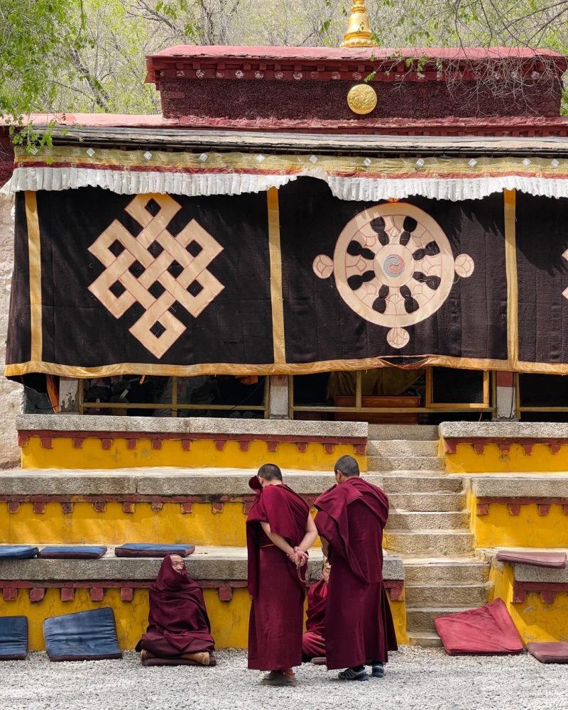 Monks gathered in the debate courtyard at Sera Monastery in Lhasa, Tibet
