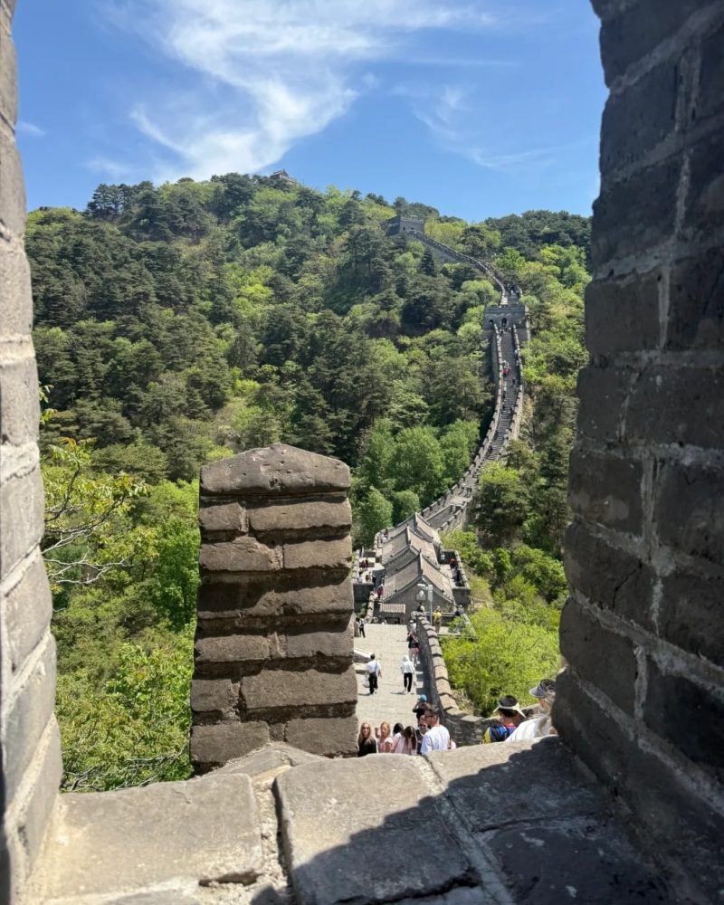 Scenic view of the Mutianyu Great Wall in Beijing surrounded by green mountains