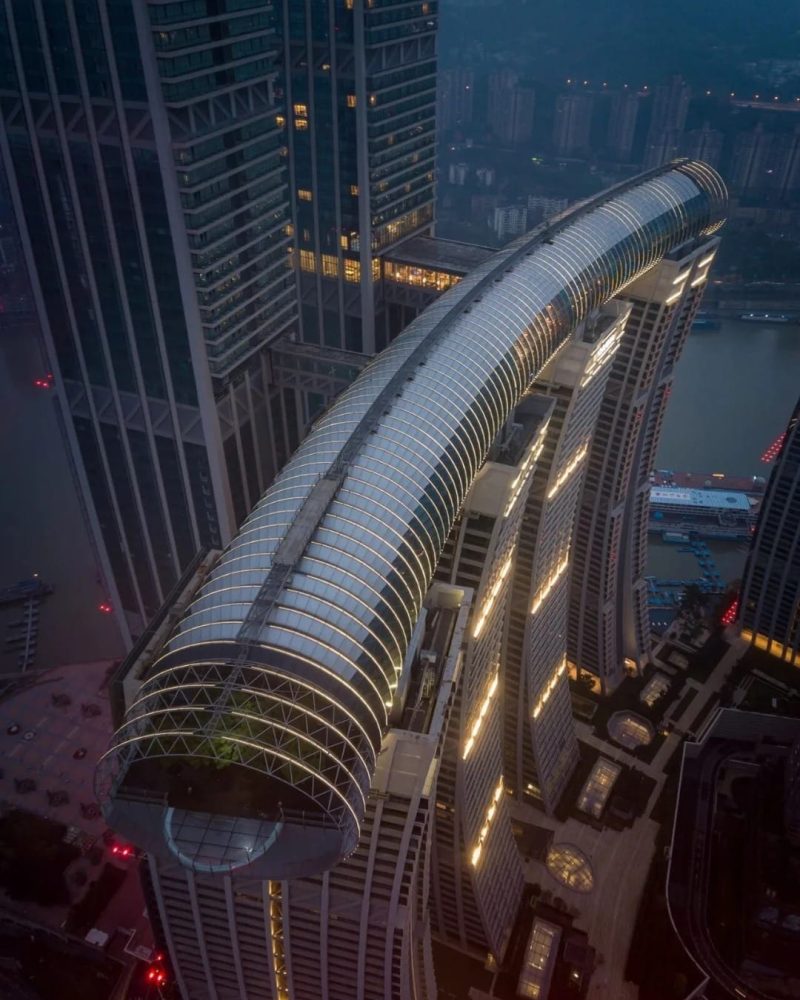 Raffles City Skybridge above Chongqing river skyline