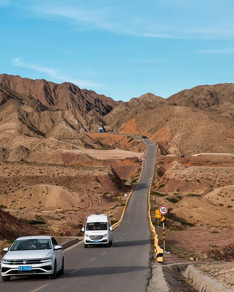 S21 Desert Highway winding through the rugged desert landscape of Northern Xinjiang