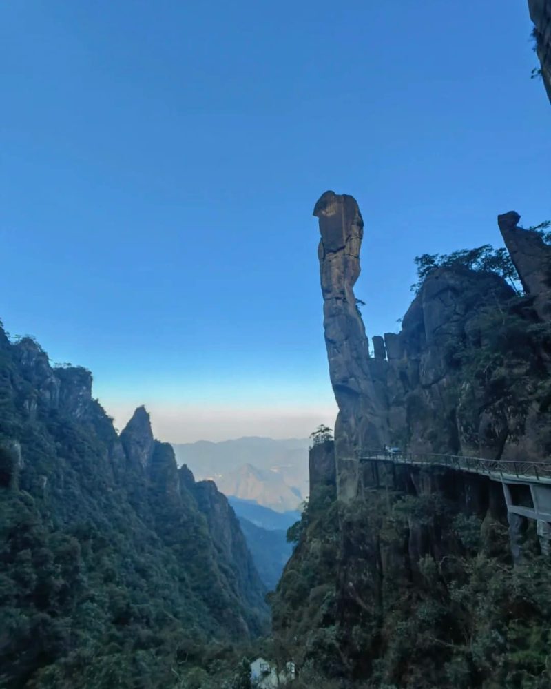 Granite peaks and cliffside boardwalk in Sanqingshan during a private China tour
