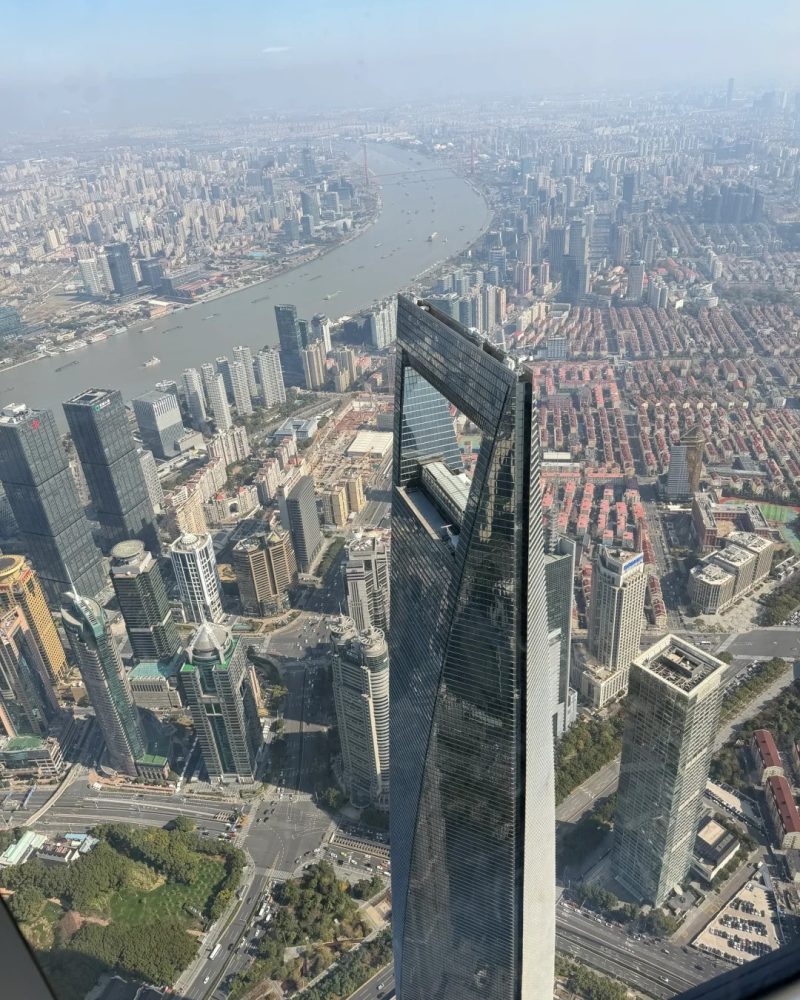 Panoramic city view from Shanghai Tower overlooking the Huangpu River and central Shanghai