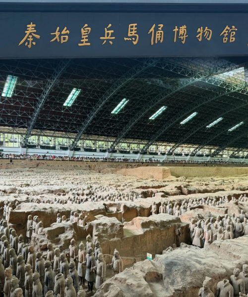 Terracotta Army Museum in Xi’an, showcasing rows of clay warriors inside the exhibition hall.