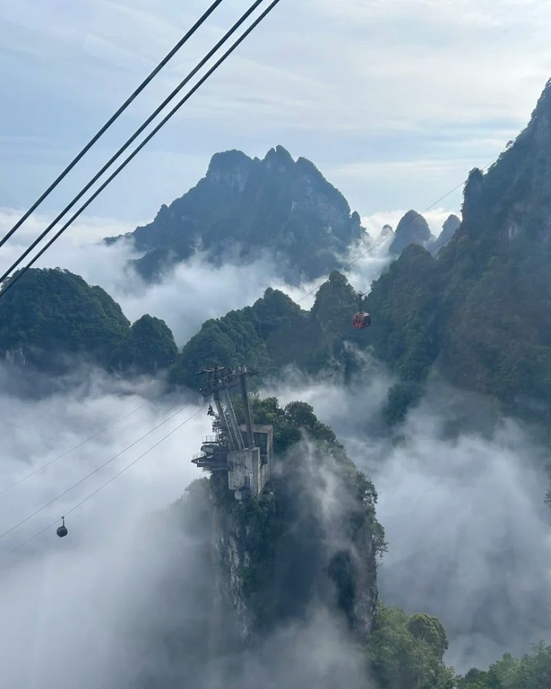 Tianmen Mountain cable car rising through clouds in Zhangjiajie