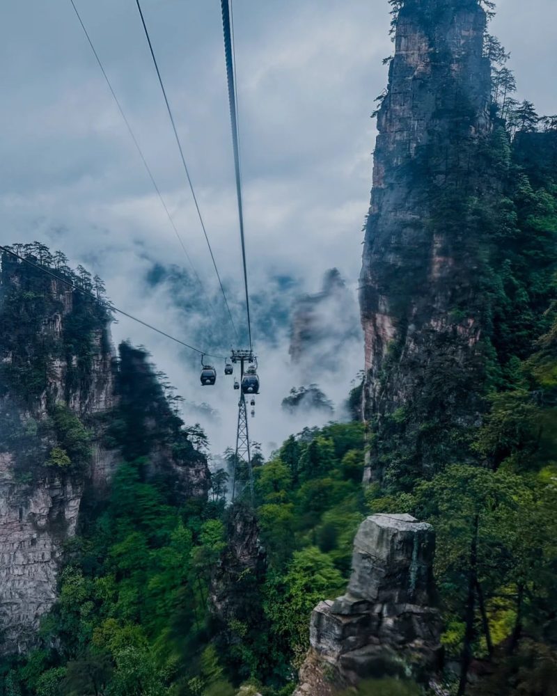 Tianzi Mountain cable car through misty peaks in Zhangjiajie