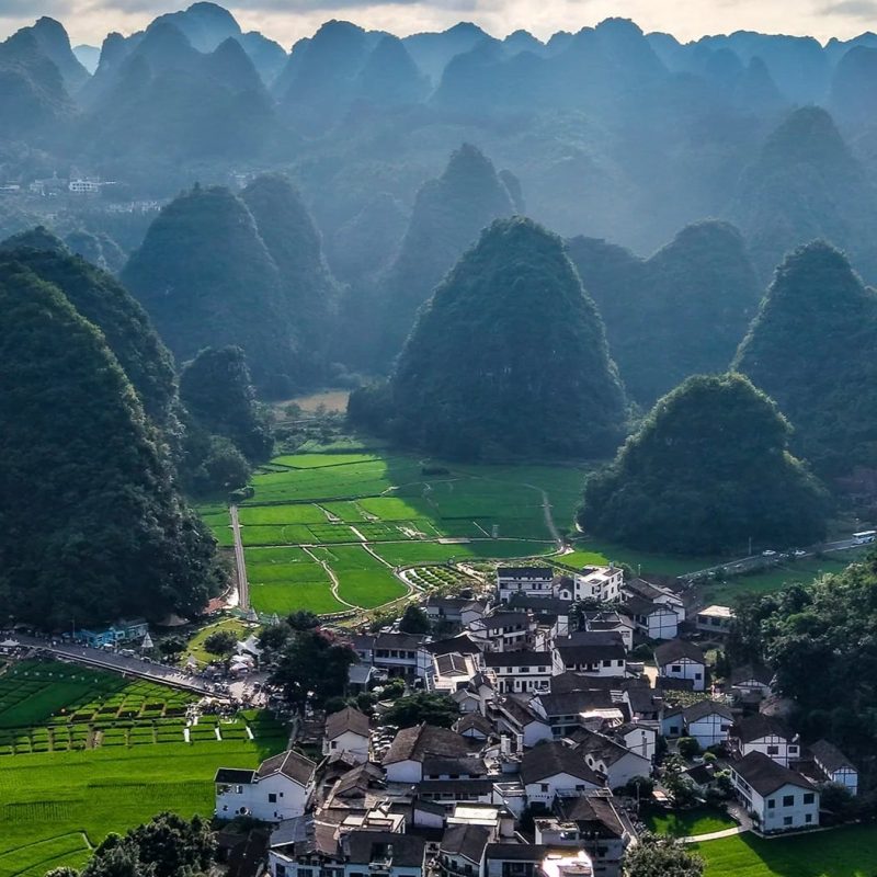 Wanfenglin, Guizhou Wanfenglin in Guizhou with karst peaks, fields, and village landscape