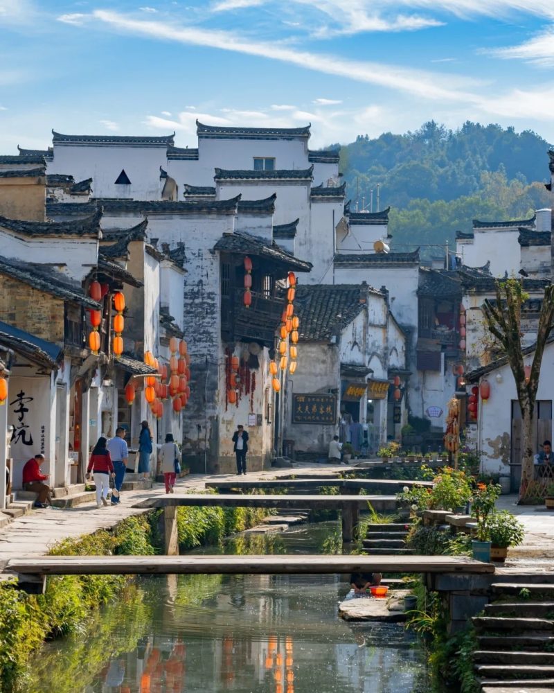 Ancient Hui-style village with canals and stone bridges in Wuyuan during a private China tour