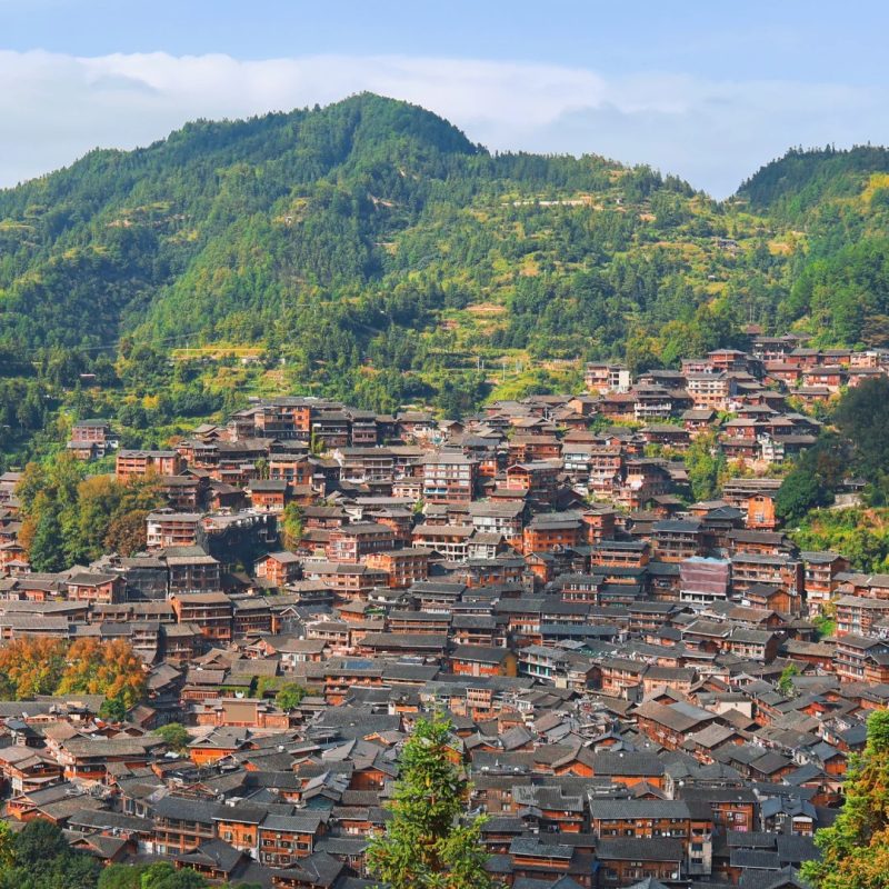Xijiang Miao Village, Guizhou Day view of Xijiang Miao Village in Guizhou with hillside wooden houses