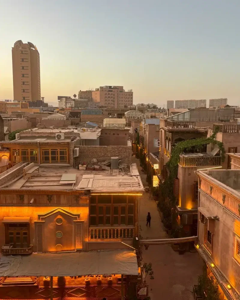 Warm sunset light over traditional rooftops and narrow lanes in Kashgar Old City, Xinjiang.