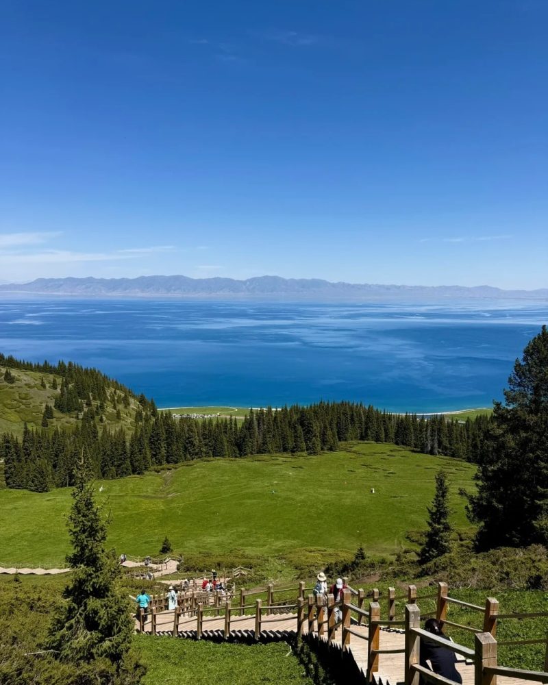 Blue Sayram Lake summer landscape for the 270-degree lake loop and sunset day in Xinjiang