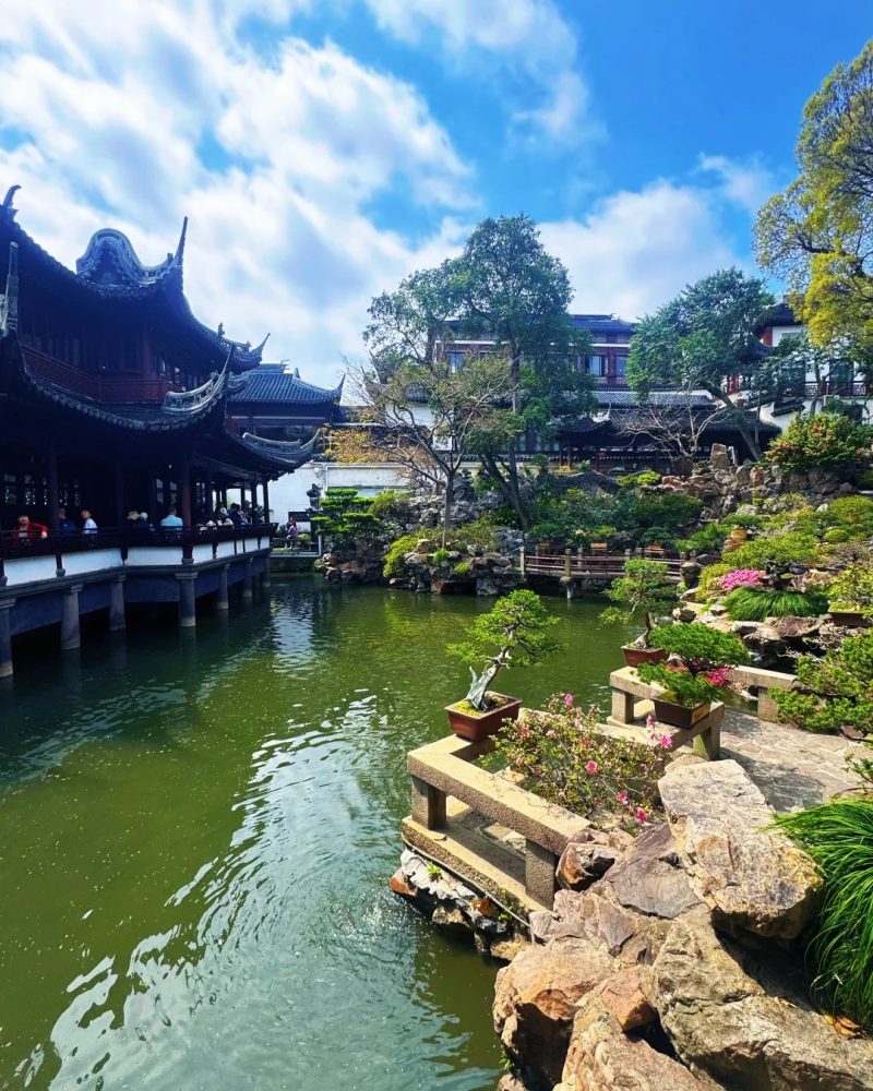 Classical garden view at Yu Garden in Shanghai, China, with traditional pavilions, water, and rock landscaping