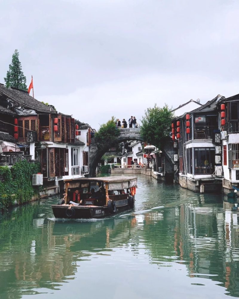 Zhujiajiao canal and stone bridge near Shanghai with a traditional boat